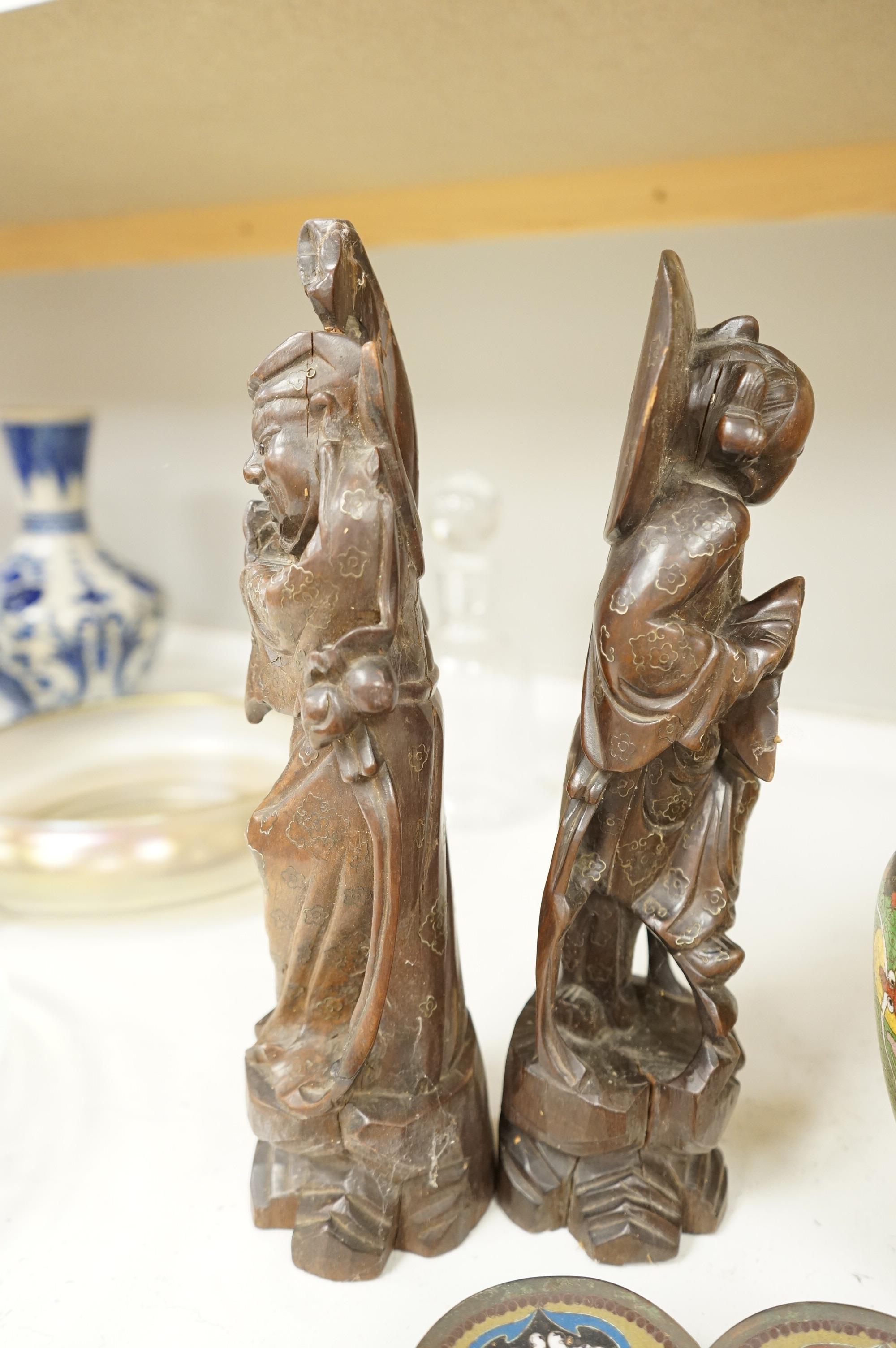 A Japanese cloisonné enamel dish, a Chinese cloisonné enamel vase and three Chinese carved wood figures, largest 39cm high
